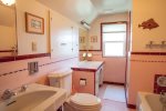 Charming and spacious second floor bathroom has a tub, separate shower and make-up area